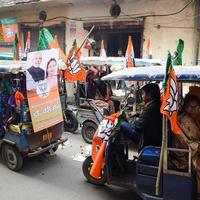 Delhi, India, December 02 2022 -Bharatiya Janata Party BJP supporter during mega road show in support of BJP candidate Pankaj Luthara to file nomination papers ahead of MCD local body Elections 2022 photo