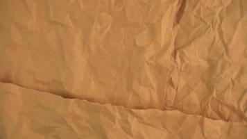 Rotating Brown Crumpled Paper Texture Background Video