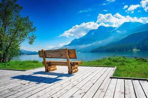 Bench with view of the mountain lake photo