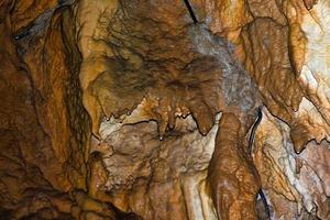 Inside a limestone cave during a speleological tourist visit photo