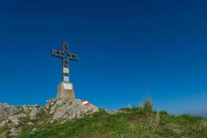 Summit cross a mountain photo