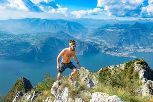 Trail running in the mountains man athlete shirtless photo