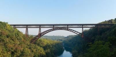 Iron bridge over the river Adda Lecco Italy photo