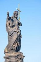 Statue of St. John Baptist. By Josef Max On the Carlo Bridge in Prague photo