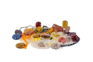 Colorful composition made of stones and glittering beads. photo