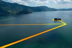 The floating piers. The artist Christo walkway on Lake Iseo photo