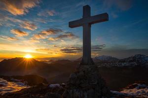 Cross a mountain in the magical sunset colors photo