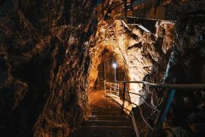 Descent into limestone caves for speleological sightseeing photo