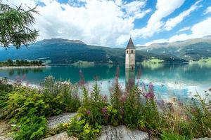 Bell tower of the Reschensee Resia South Tyrol Italy