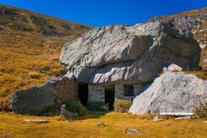 Stone house in the mountain photo