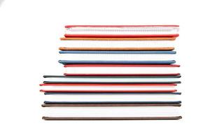 Stack of diaries on white background photo