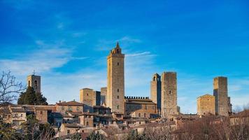 The medieval village of San Gimignano with its famous towers. in tuscany Italy photo