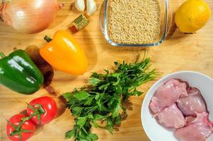 Raw ingredients. Ready to be cooked. Recipe for chicken stew, European cuisine, cooked with a garnish of mushrooms, small onions and other. photo