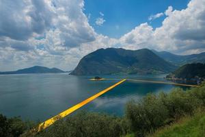 The floating piers. The artist Christo walkway on Lake Iseo photo