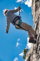 Climbing school for children with a double rope downhill photo