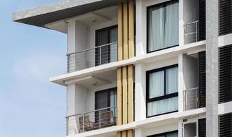 Pattern glass window on modern white building photo