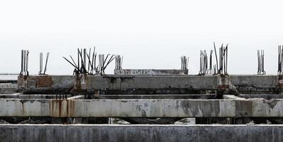 Concrete structure of unfinished abandoned house project photo