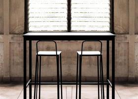 Black steel table bar and stool with louvre window photo