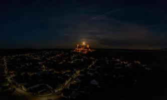 Image of illuminated Muenzenberg castle ruin in Germany in the evening photo