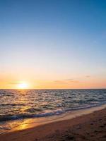 Front viewpoint landscape travel summer sea wind wave cool on holiday calm sea coastal area big sun set sky light orange golden Nature tropical Beautiful evening hours day At Bang san Beach Thailand. photo