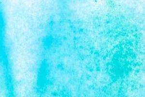 Blue and green watercolor on white paper canvas. Abstract art background photo