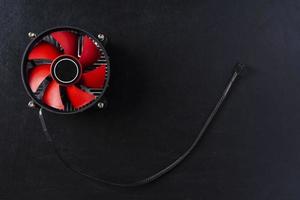 Computer cooler, top view of a computer processor cooler on a black background photo