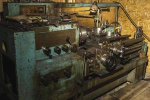 Old metal lathe in the workshop, metalworking, machine tools photo