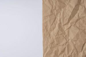 Background of crumpled wrapping paper and white space for copying text, beige rough sloppy creative background photo