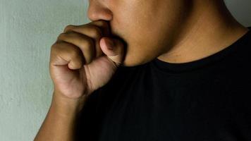 close up of man coughing. medical and healthcare concept. coughing because cold and bronchitis photo