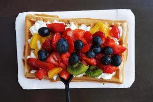 Waffle with Whipped Cream and Fruits photo