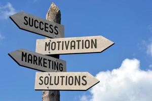 Success, Motivation, Marketing, Solutions - Wooden Signpost photo