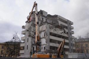 Multistorey Building Demolished and Dismantled by Machine photo