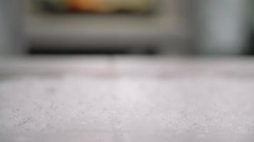 Woman Sprinkling Flour Onto the Counter video