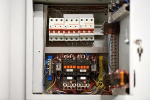 Circuit breaker in switch box. Control voltage switchboard. Distribution board for control electrical voltage in house or office. photo