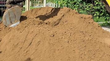 Up close view of excavator digging into the ground video