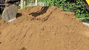 Up close view of excavator digging into the ground video