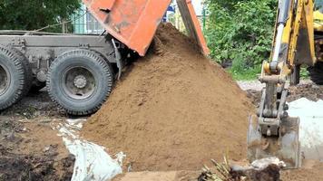 Up close view of excavator digging into the ground video