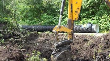 Up close view of excavator digging into the ground video