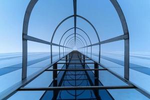 Fire escape staircase. Stairway to Heaven concept. Emergency fire exit. Bottom view photo