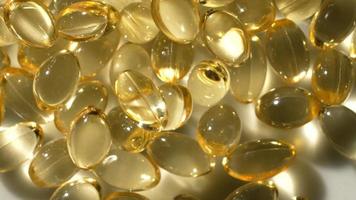 Vitamins D, capsules omega 3, macro video