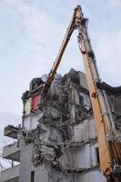 Multistorey Building Demolished and Dismantled by Machine photo