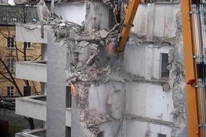 Multistorey Building Demolished and Dismantled by Machine photo