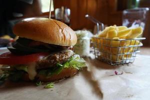 Burger and French Fries on Table photo