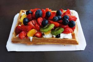 Waffle with Whipped Cream and Fruits photo