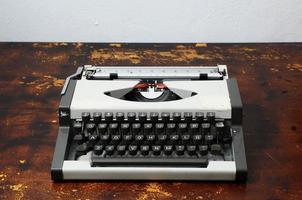 Typewriter on a wooden table photo