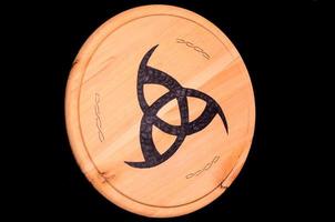 Biohazard symbol on wooden pieve photo