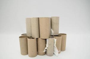 Empty toilet paper rolls on white background photo