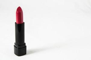 Red lipstick on white background photo