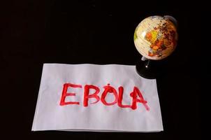 Ebola sign on black background photo