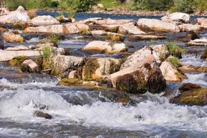 Water run with rocks photo